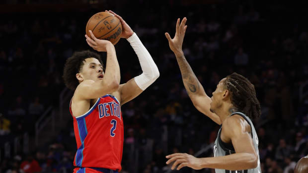Dec 12, 2021; Detroit, Michigan, USA; Detroit Pistons guard Cade Cunningham (2) shoots on Brooklyn Nets forward Nic Claxton (33) in the second half at Little Caesars Arena. Mandatory Credit: Rick Osentoski-USA TODAY Sports